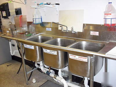 All stainless steel 3 compartment sink with faucet.