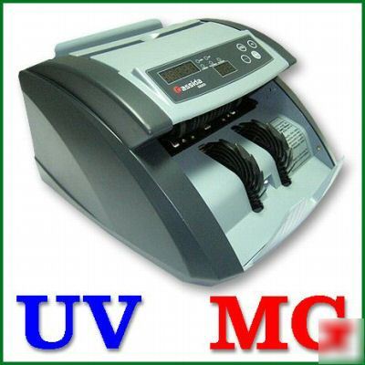 Commercial cash counter with counterfeit detection