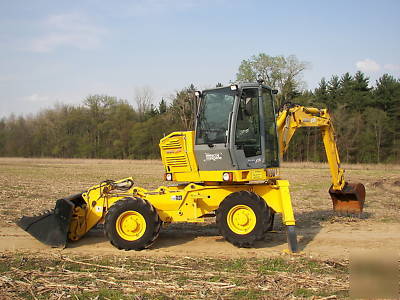 Wow--2003 multi job 360 degree back hoe loader must see