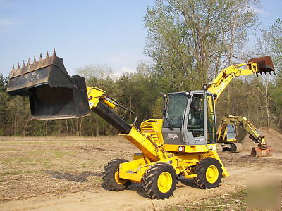 Wow--2003 multi job 360 degree back hoe loader must see