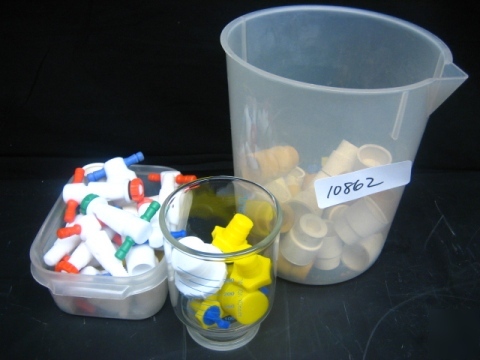 Assorted lab stoppers, varying size caps and valve caps