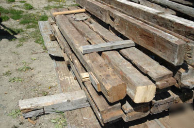 Reclaimed hand-hewn log siding (circa 1800 - 1850) 