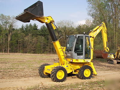 Wow--2003 multi job 360 degree back hoe loader must see