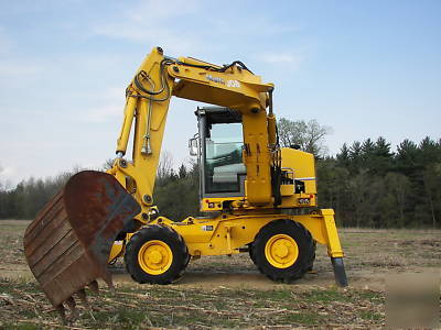 Wow--2003 multi job 360 degree back hoe loader must see