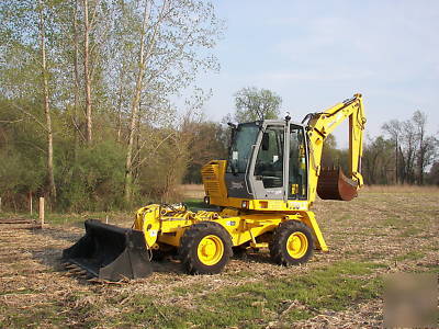 Wow--2003 multi job 360 degree back hoe loader must see