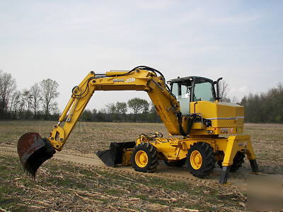 Wow--2003 multi job 360 degree back hoe loader must see