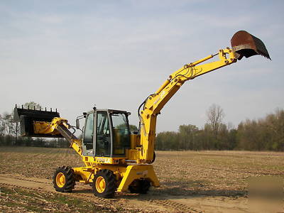 Wow--2003 multi job 360 degree back hoe loader must see