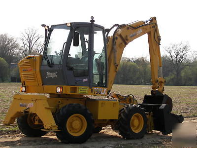 Wow--2003 multi job 360 degree back hoe loader must see