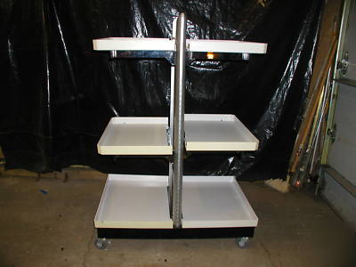 Adjustable store shelf on wheels