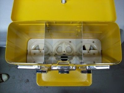 Coin operated 3 compartment vending machines yellow.