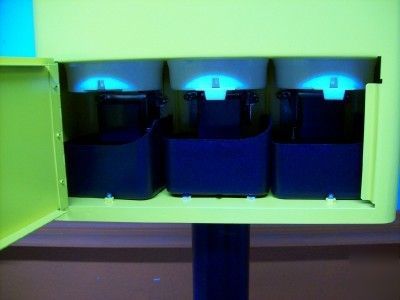 Coin operated 3 compartment vending machines yellow.