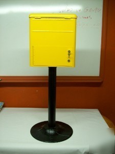Coin operated 3 compartment vending machines yellow.