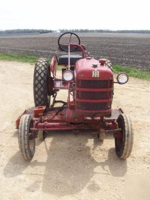 Ih cub lo boy mowing tractor
