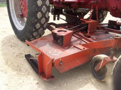 Ih cub lo boy mowing tractor