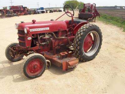 Ih cub lo boy mowing tractor