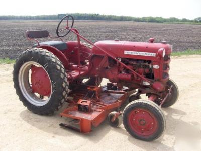 Ih cub lo boy mowing tractor