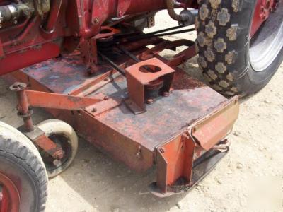 Ih cub lo boy mowing tractor