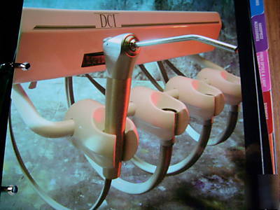 Dci alternative arm-mounted automatic delivery system