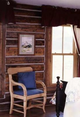 Reclaimed hand-hewn log siding (circa 1800 - 1850) 