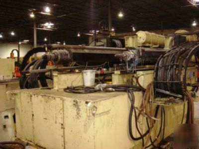 660 ton, 22.8 oz. + 36.1 oz. husky injection molder '97